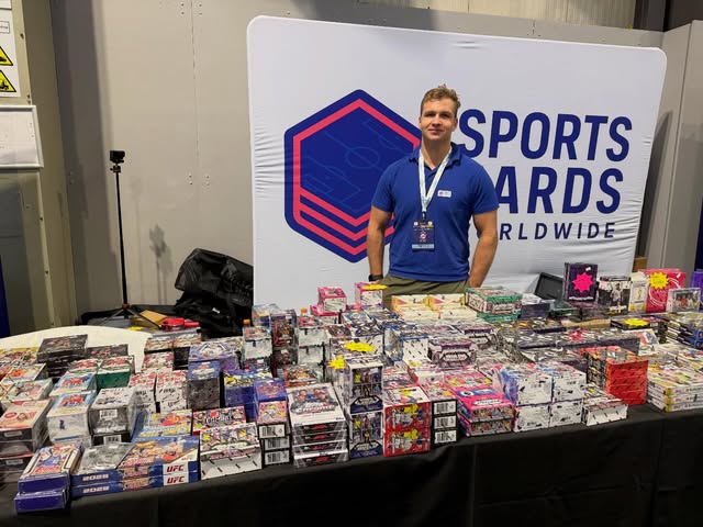 Sports Cards Worldwide at a show — blue polo photo